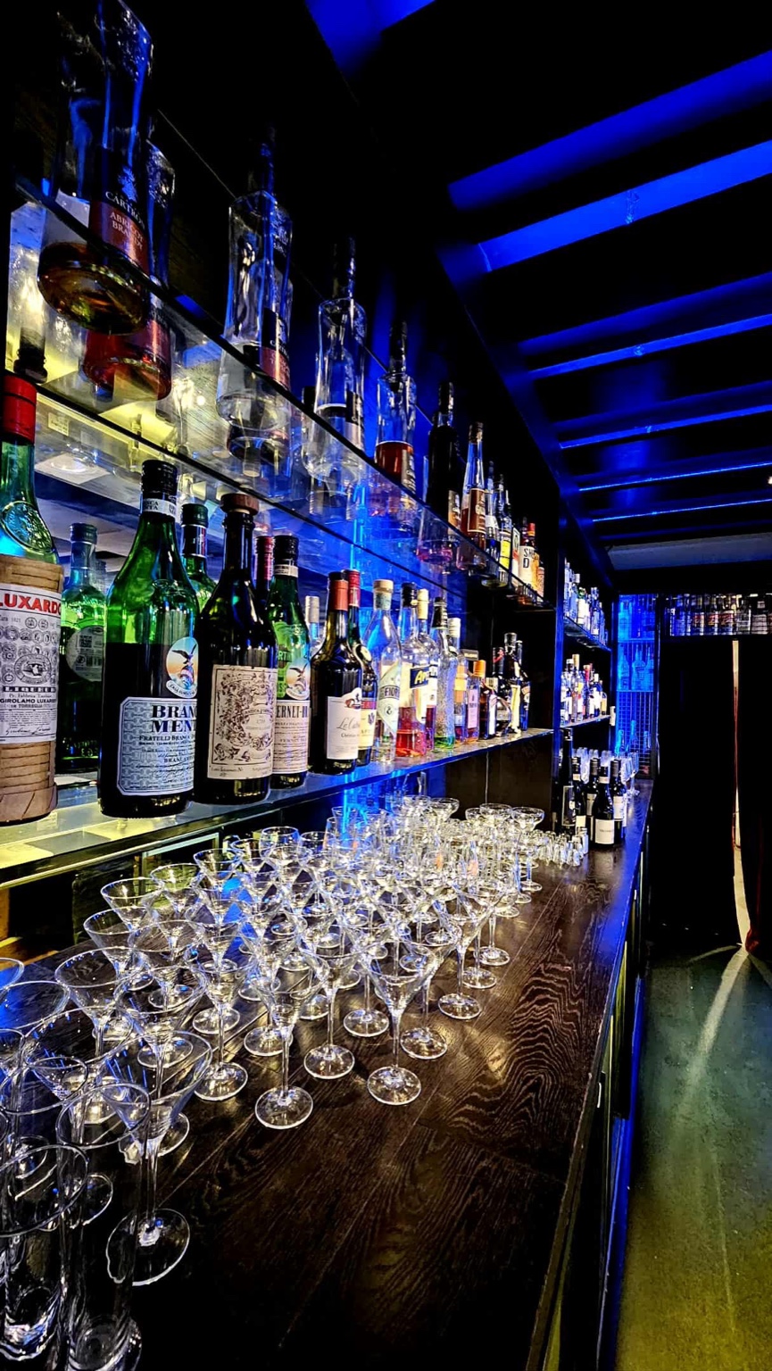 Back bar shelves with glassware and spirits