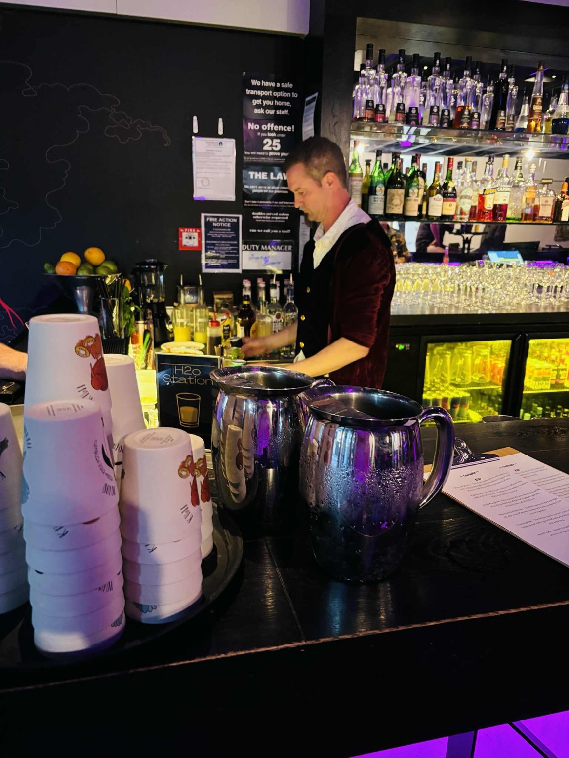 Bartender mixing drinks at Tails